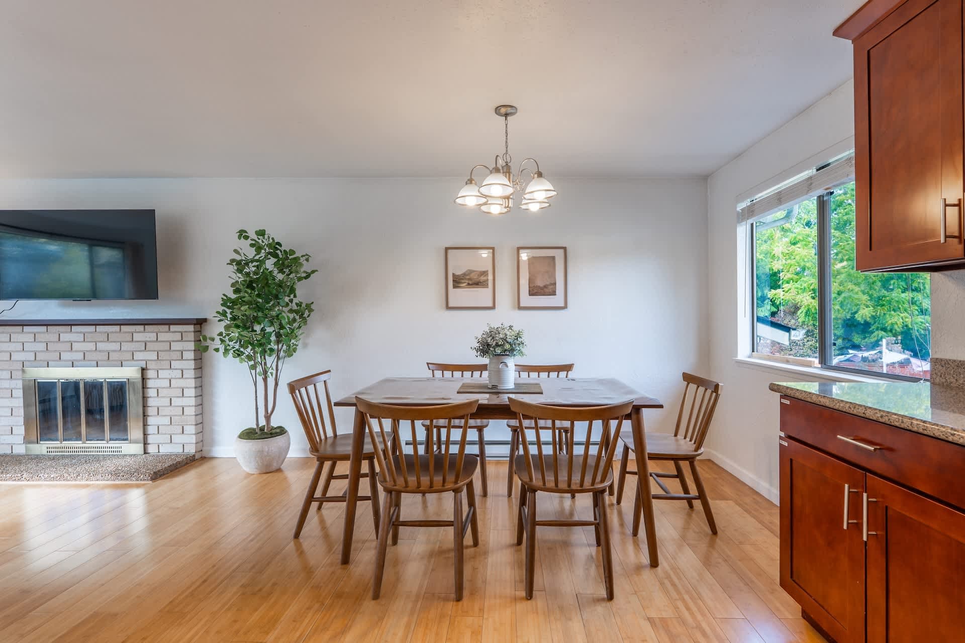 An inviting open-concept dining area flowing into a well-appointed kitchen, perfect for entertaining.
