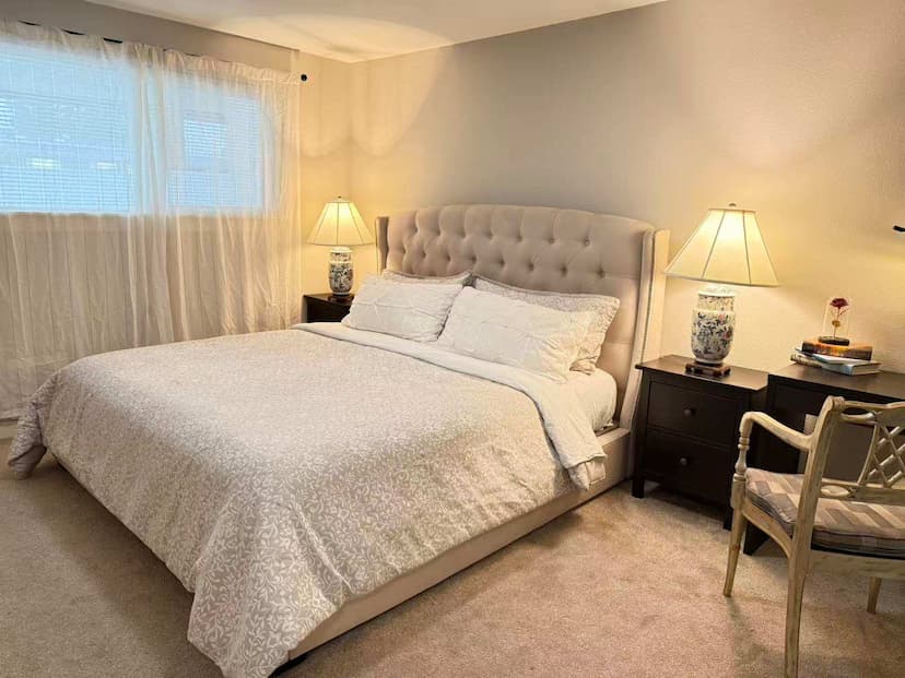 Drift off to sleep in your tranquil, private haven—a bright bedroom designed for deep comfort and rest.