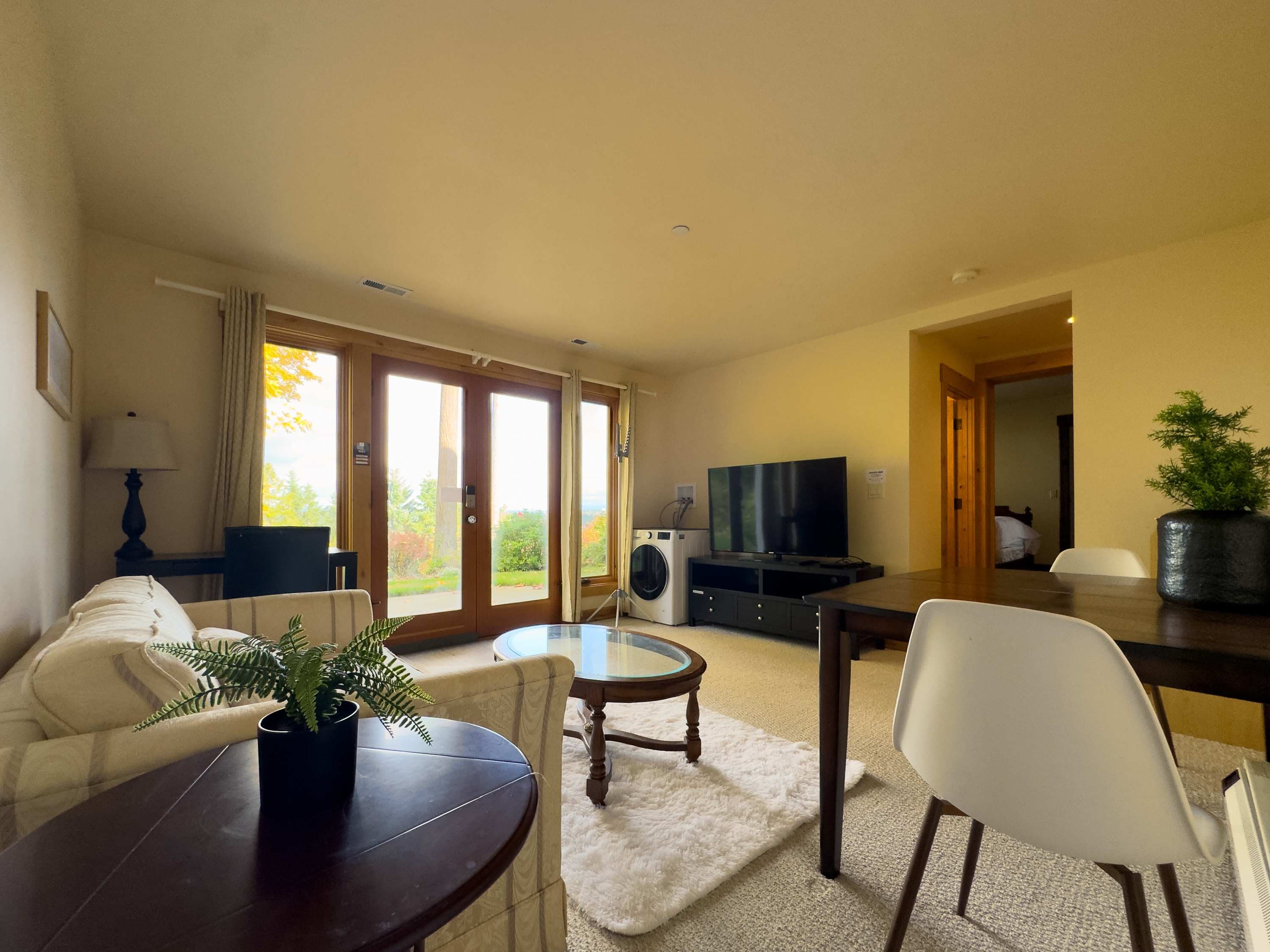 Relax in the light-filled living room, a perfect blend of modern comfort and natural light.