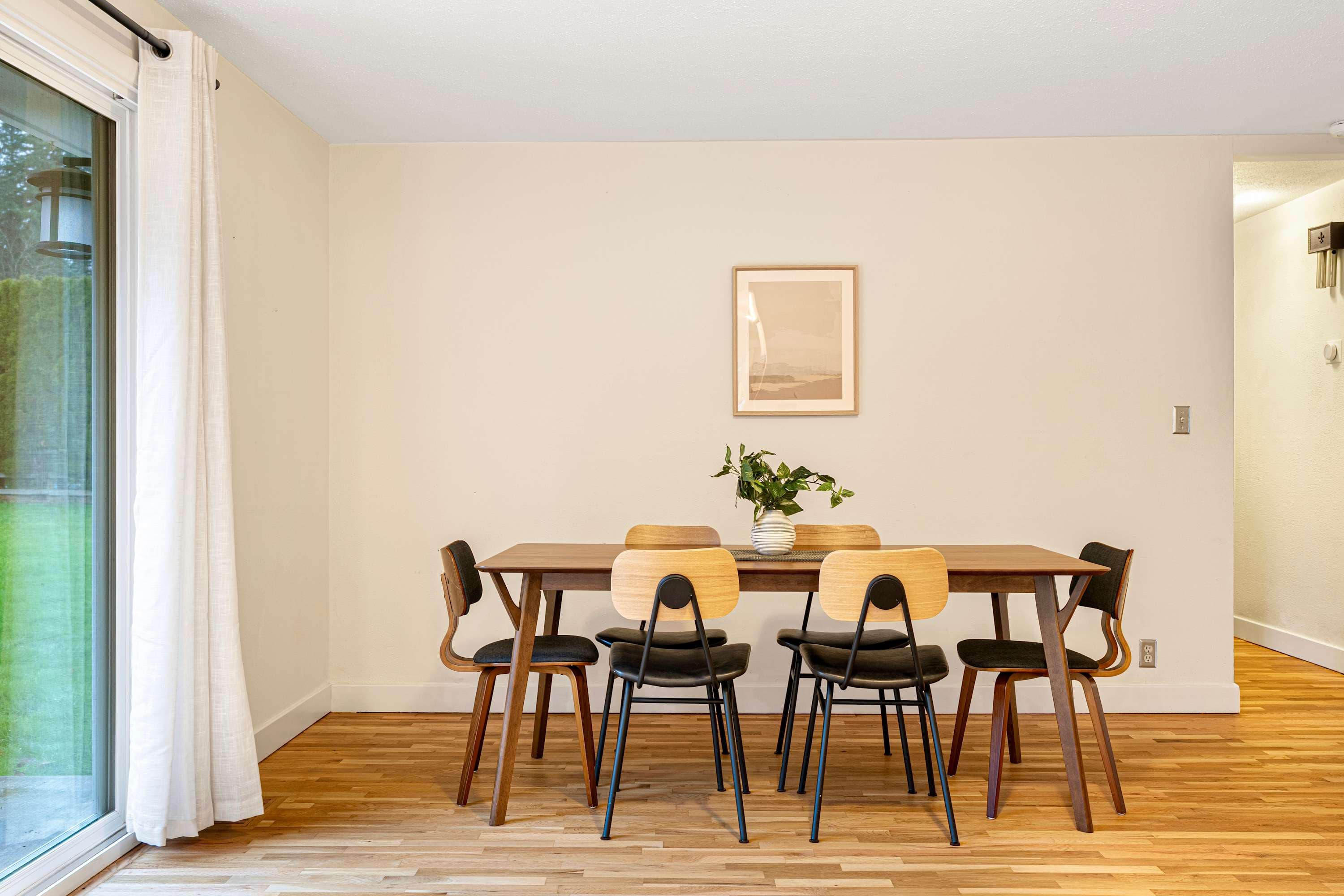 Gather your loved ones and savor the joy of sharing meals in this sunlit, classic space.