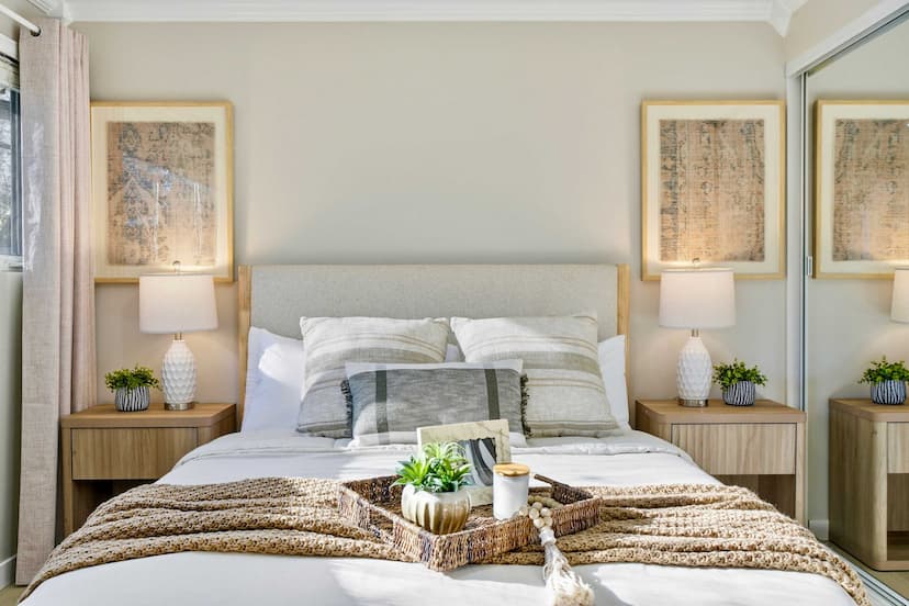 Serene bedroom featuring a plush bed, soft linens, and calming décor for a restful night’s sleep.