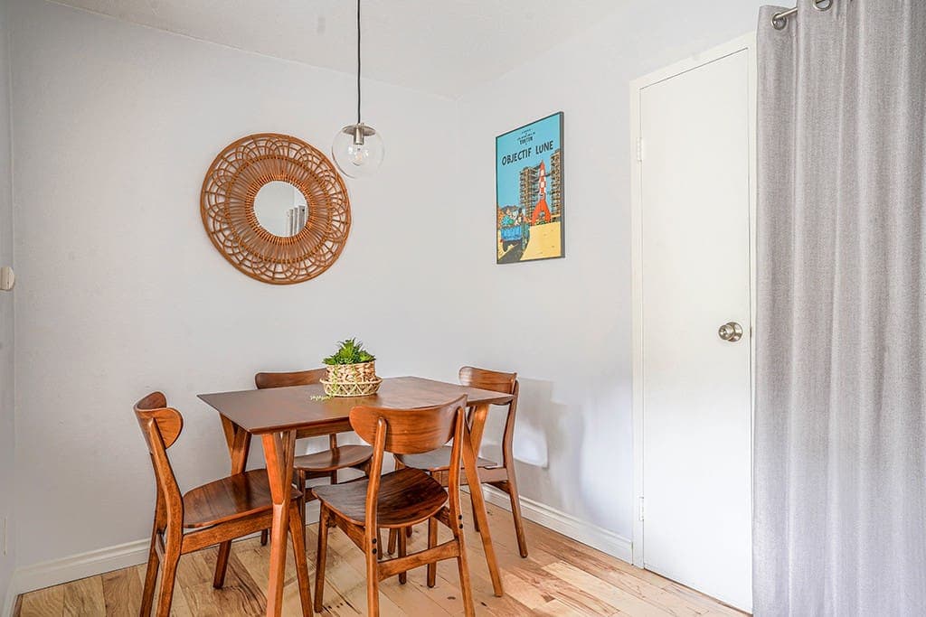 Enjoy meals in the cozy dining area that blends effortlessly with the open living space, featuring natural light, modern seating, and a relaxed ambiance for any occasion.