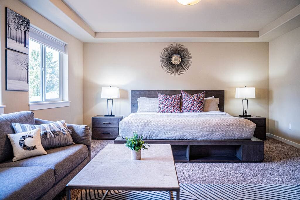 Elegant master bedroom with generous space, large windows for natural light, and a calming atmosphere perfect for restful island living.