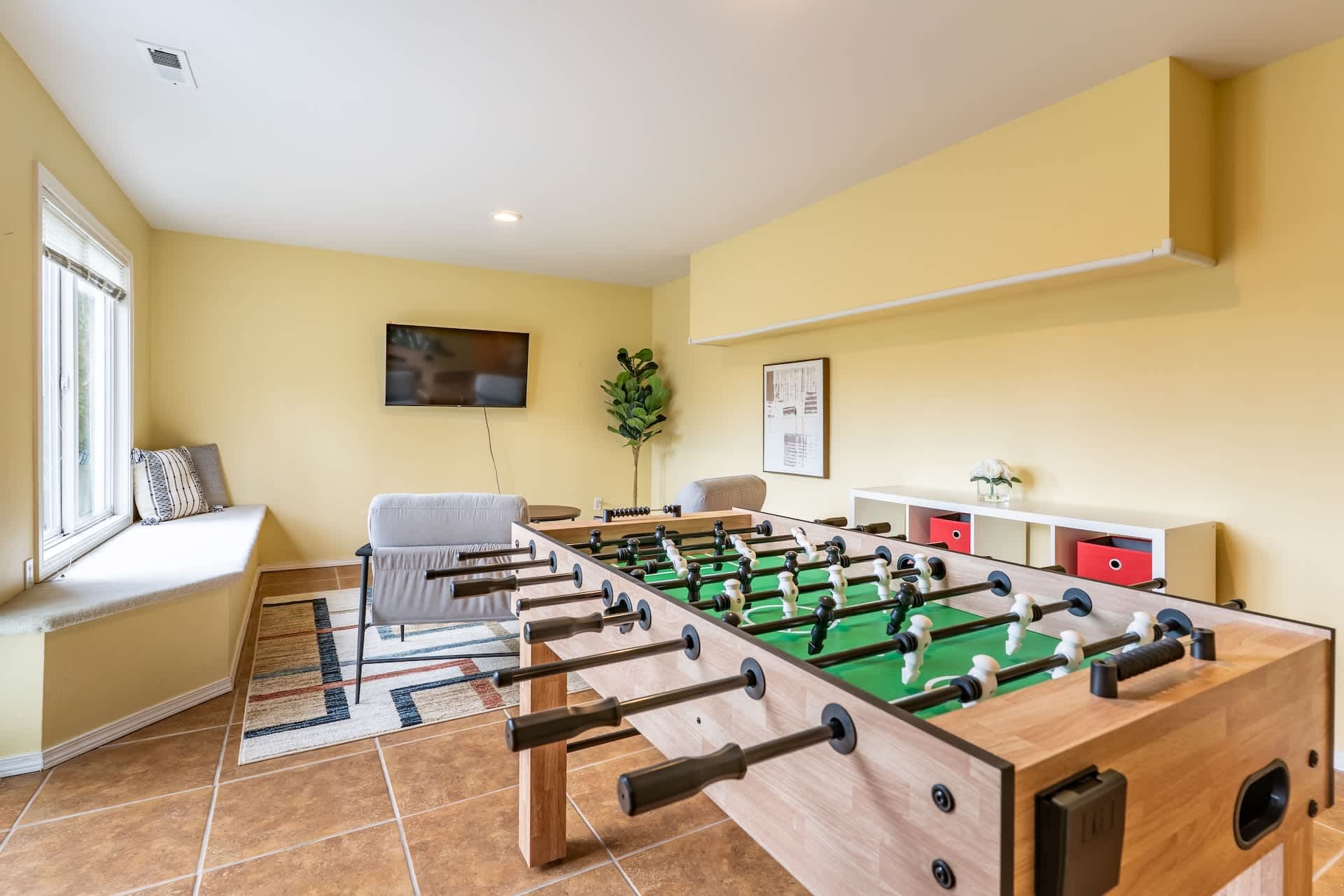 Game on! Enjoy friendly competition with foosball fun in the basement.