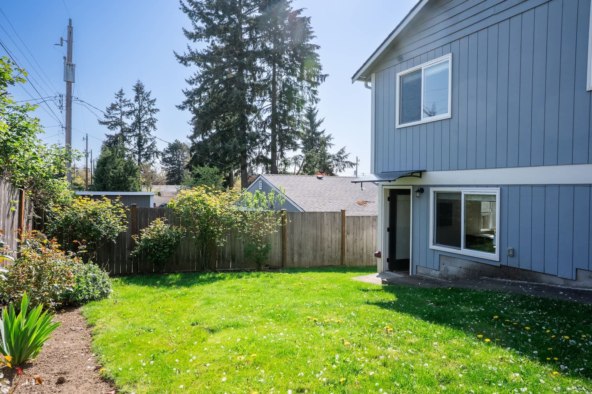 The entrance feels inviting, and the backyard provides a peaceful space to unwind.