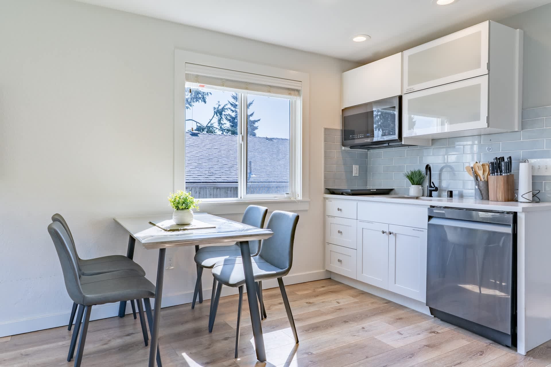 The dining area and kitchen offer an enjoyable, seamless space for cooking and gathering.